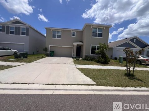 A house with a driveway in front of it.