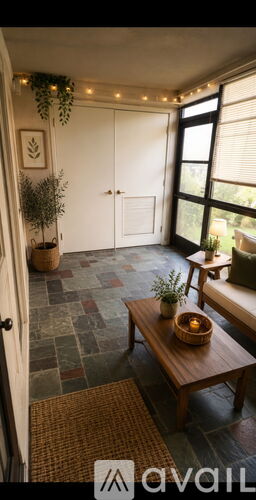 A room with a wooden table and a plant on it.