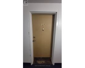 A brown door with the number 108 on it.