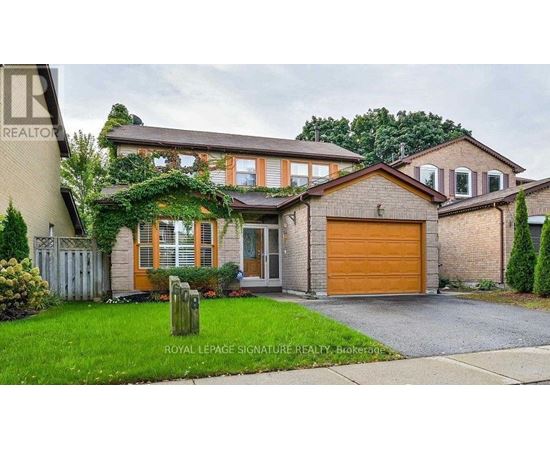 A house with a brown garage door is for sale.