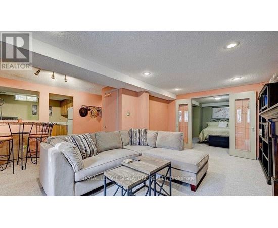 A living room with a grey couch and a coffee table.