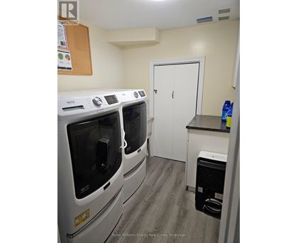 A laundry room with a washer and dryer.