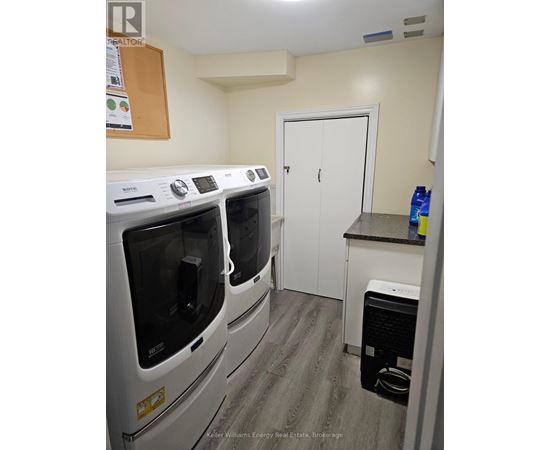 A laundry room with a washer and dryer.