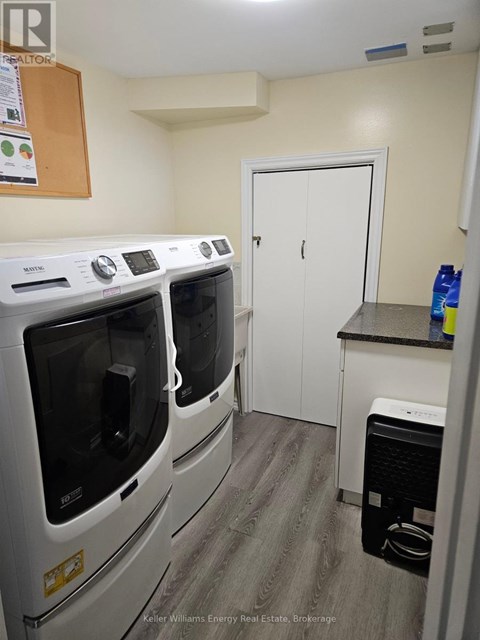 A laundry room with a washer and dryer.