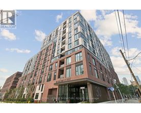 A tall building with a sign that reads "Royal Lease Signature Realty" in front of it.