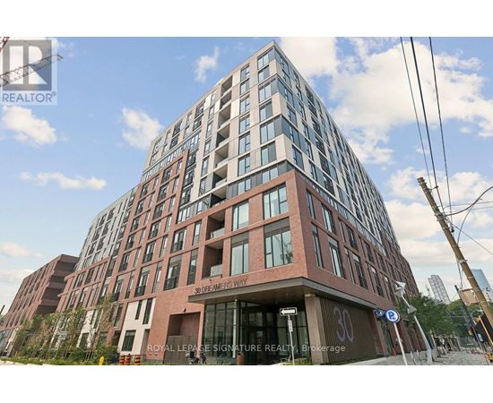 A tall building with a sign that reads "Royal Lease Signature Realty" in front of it.