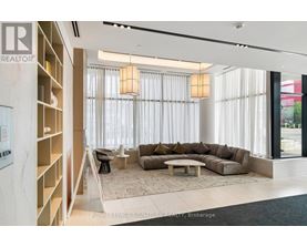 A living room with a couch, chairs, and a coffee table.