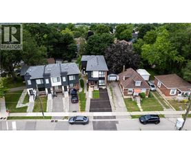 A bird's eye view of a neighborhood with houses and cars.