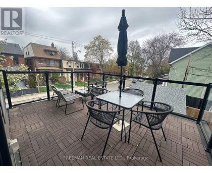 A patio with a table and chairs is shown.