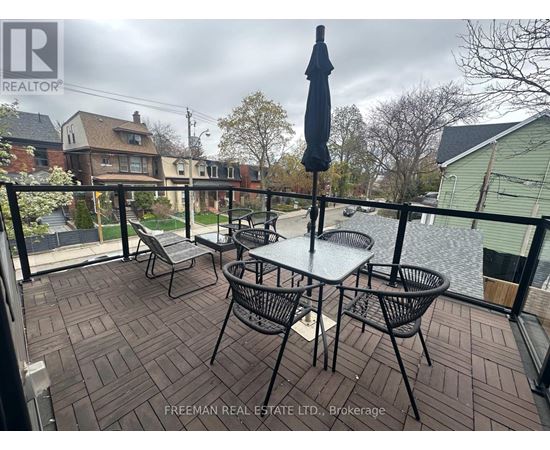 A patio with a table and chairs is shown.