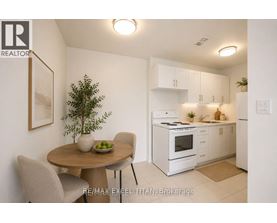 A small dining area with a table and chairs.