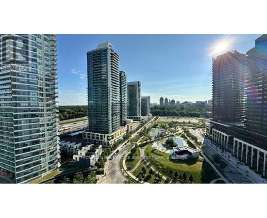 A cityscape with tall buildings and a clear sky.