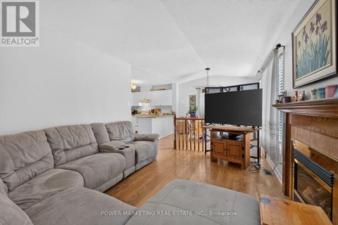 A living room with a grey sofa and a television.