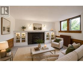 A well-lit living room with a fireplace and a couch.