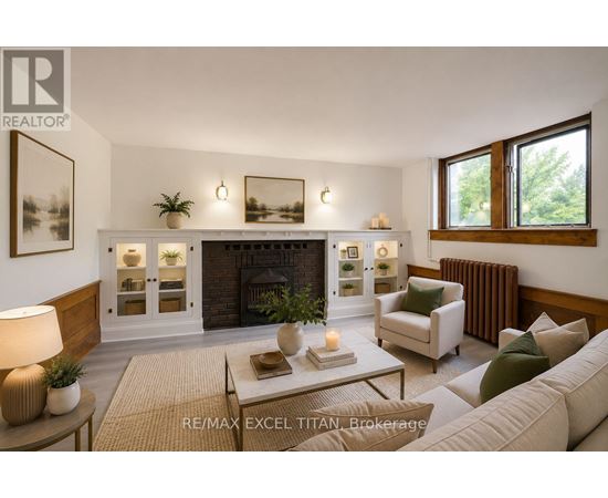 A well-lit living room with a fireplace and a couch.