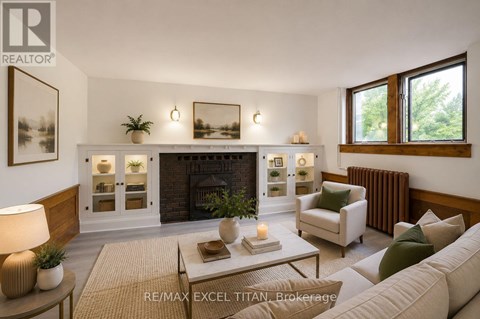 A well-lit living room with a fireplace and a couch.