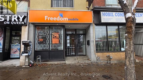 A storefront with a FreedomMobile sign is visible.