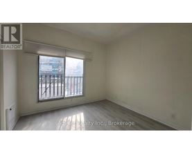 A room with a window and a sign that says Advent Realty Inc., Brokerage.