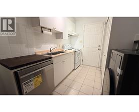 A small kitchen with a dishwasher and a sink.
