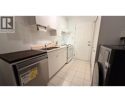 A small kitchen with a dishwasher and a sink.