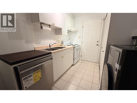 A small kitchen with a dishwasher and a sink.