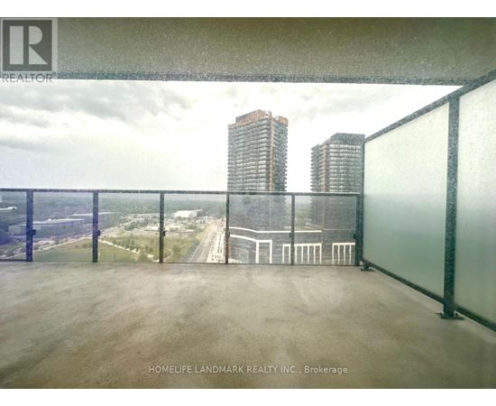 A balcony with a view of the cityscape and a building with the logo "REALTOR" on the railing.