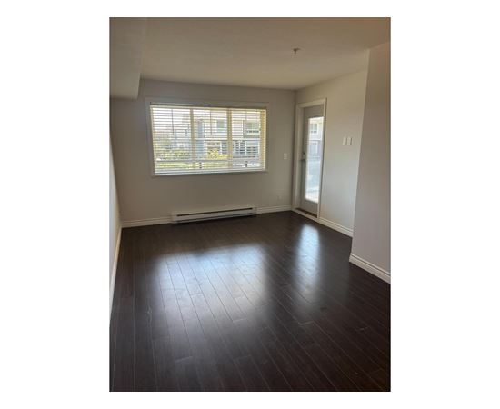 A room with a window and a door.