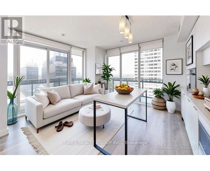 A modern living room with a white sofa, a glass coffee table, and a view of the city.