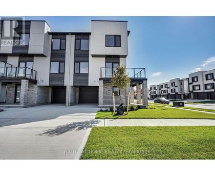 A modern apartment complex with a clear blue sky above.