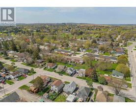 A bird's eye view of a residential neighborhood with houses and trees.