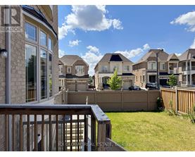 A row of houses with a clear blue sky above them.