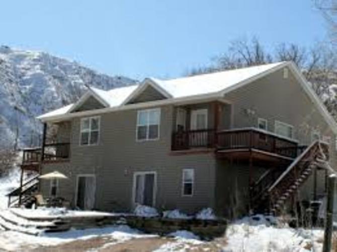 A house with a mountain in the background.