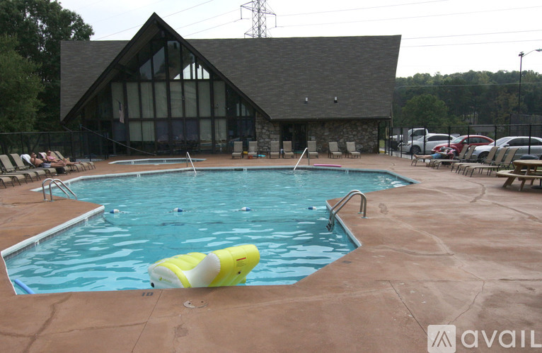 A pool with a yellow float in the middle of it.