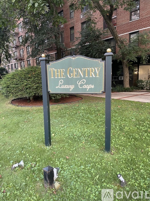 A sign that says The Gentry Luxury Cars.