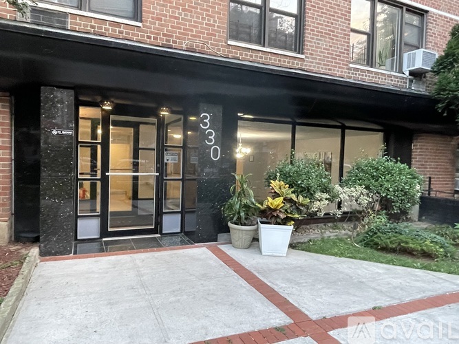The image shows a building entrance with a glass door and a number 3030 on it.
