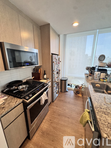 A kitchen with a stove top oven and a microwave.