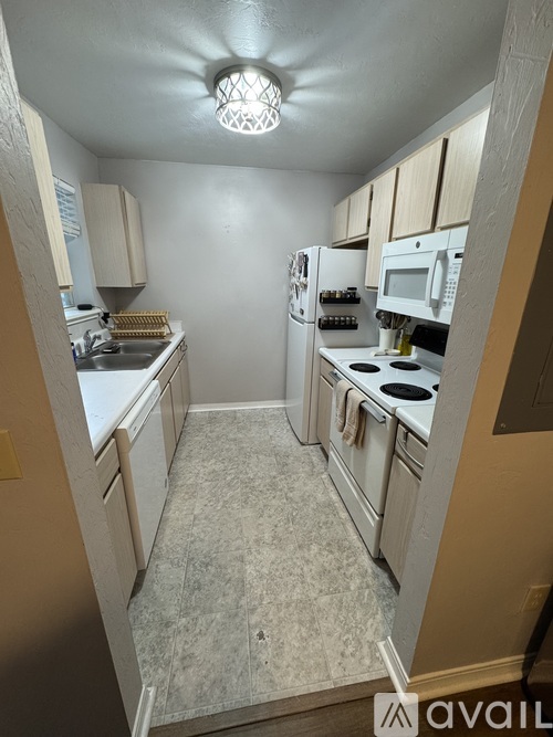 A kitchen with a stove top oven and a microwave.