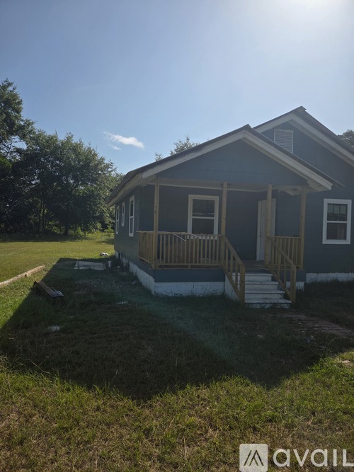A house with a porch and a covered entrance.
