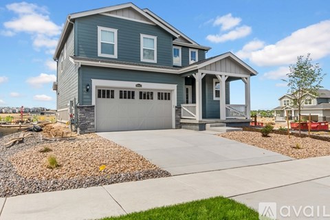 A house with a garage and a front porch.