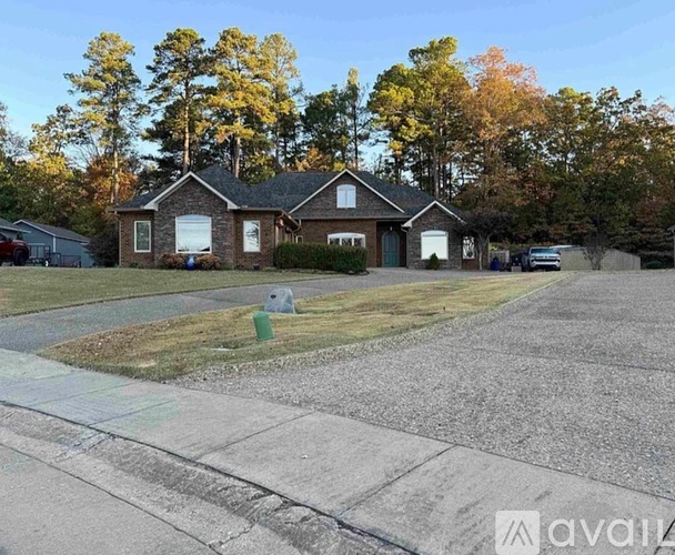 A house with a driveway in front of it.