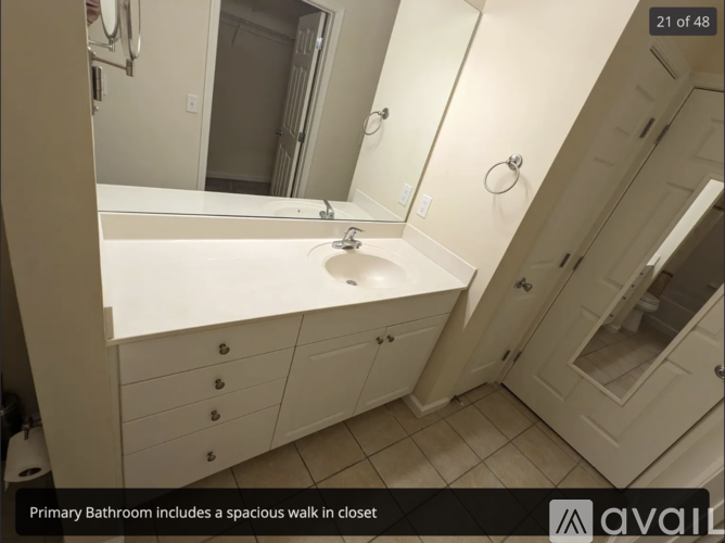 A bathroom with a spacious walk in closet.