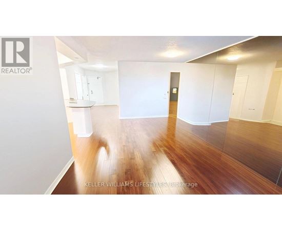 A room with wooden floors and white walls.