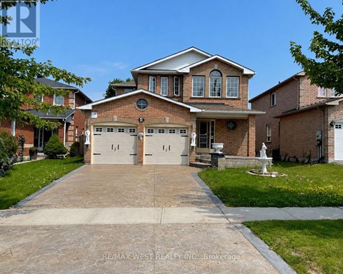 A large house with a garage is for sale.