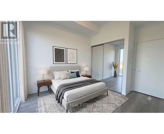 A bedroom with a bed, nightstand, and two framed pictures on the wall.