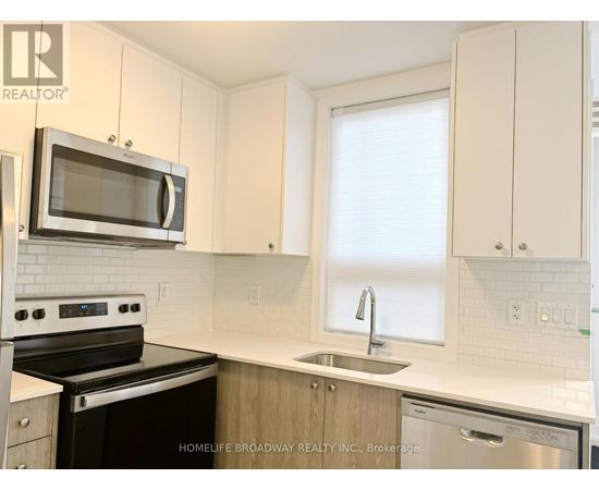 A kitchen with a stove, microwave, and dishwasher.