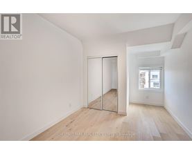 A room with a sliding door and a window.