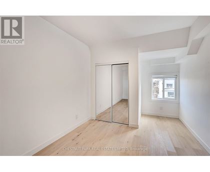 A room with a sliding door and a window.
