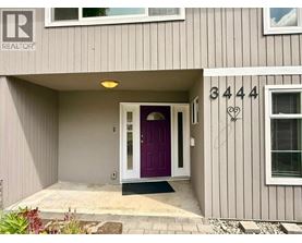 A house numbered 3444 with a purple door.