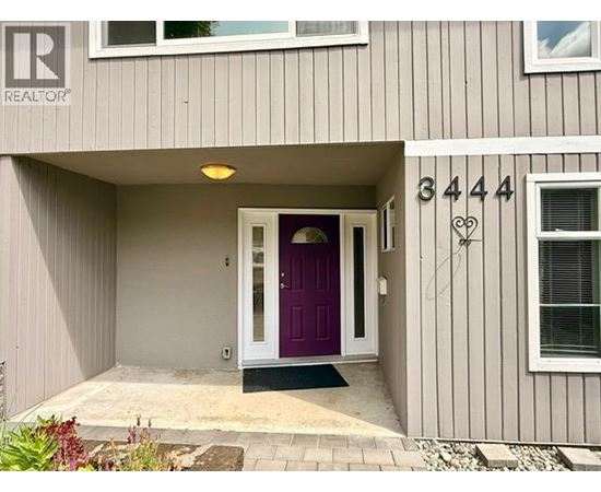 A house numbered 3444 with a purple door.