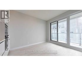 A white room with a window and a sign that says Baytree Real Estate Inc.
